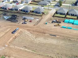 airal view of excavating beside a developement